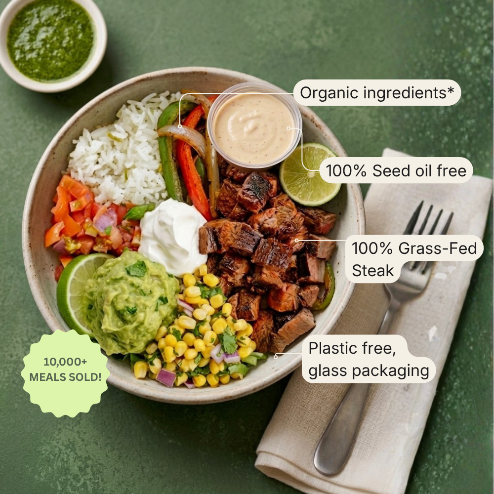A prepared meal bowl on a green table with text callouts about ingredients and packaging benefits. The bowl contains rice, mixed vegetables, grilled steak, guacamole, corn, and a small dipping sauce.